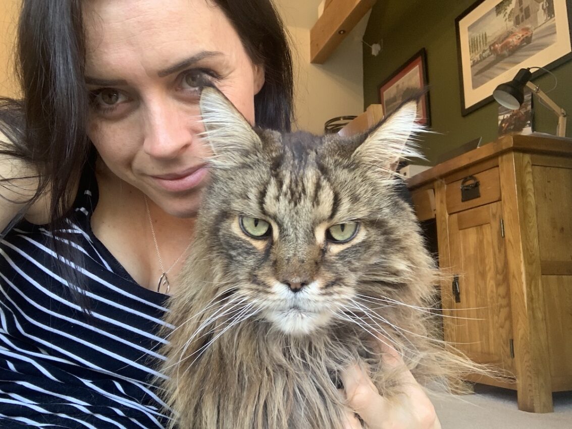 Katrina sat holding Pippin - her first Maine Coon cat